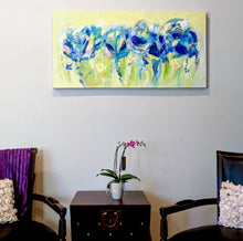 Load image into Gallery viewer, Floral abstract, mix of purple and blue on a light green and yellow background, displayed. Horizontal, long painting for above fireplace or above bed or foyer.