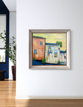 Load image into Gallery viewer, A painting titled 'Siesta', depicting a scene with buildings and a clear sky in the afternoon.
